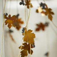 BRASS LEAF AND WOODEN BEAD HANGING DECORATION