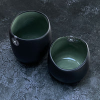 BLACK STONEWARE TEALIGHT WITH GREEN GLAZE INSIDE